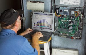 programming an HVAC system with a laptop photo