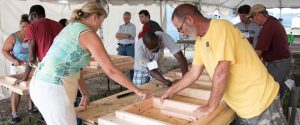 Students learn basic construction skills in a class