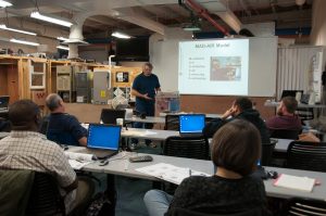 Neil Moyer teaching a course on weatherization, photo