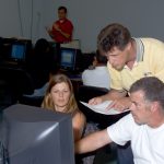 Rob Vieira teaching two students in a classroom