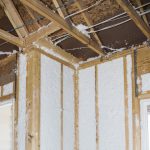 Dense packed insulation in unfinished construction framed wall
