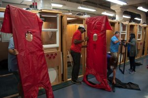 Students assemble a blower door in a class