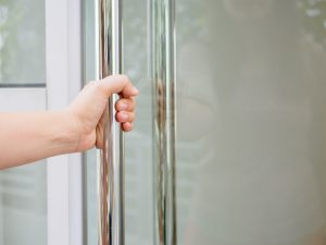 Women hand opening a door photo