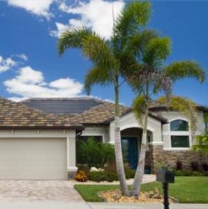 One-story, LifeStyle Net-Zero Energy Home, with palm tree in front; photo..