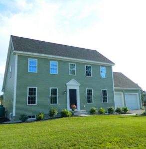 Two-story, two-car garage with shingled roof, Zero Energy Home, photo.