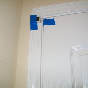Data logger taped to interior door frame.