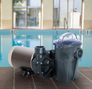 swimming pool pump and filter sitting on swimming pool deck