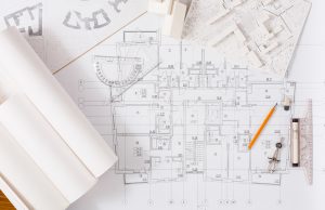 Workplace of architect with floor plans photo