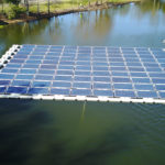 Floating solar system (10 panels x 10 panels)in Orlando, Fla. is part of research project. It is anchored in retention pond, accessed by personal watercraft. 