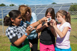 Susan Schleith helps school girls learn how PV works