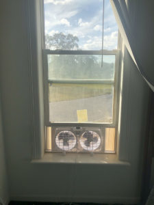 Inexpensive dual blade, horizontal window fan in bedroom windo